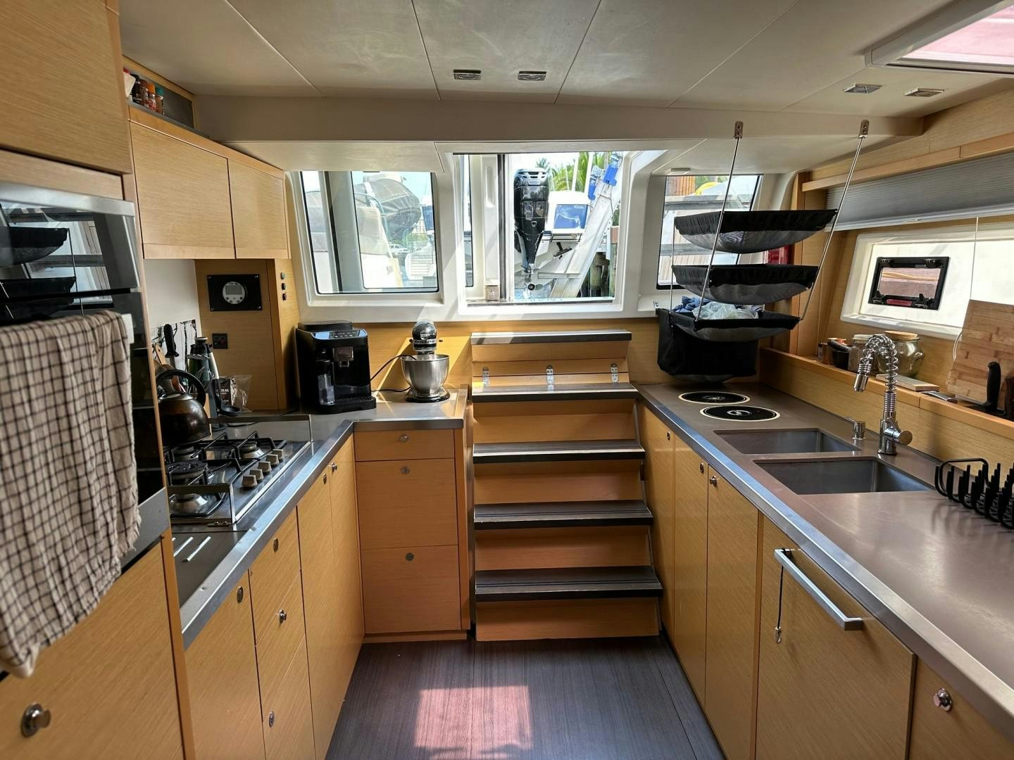 a kitchen with wooden cabinets aboard OCEAN VIEW Yacht for Sale