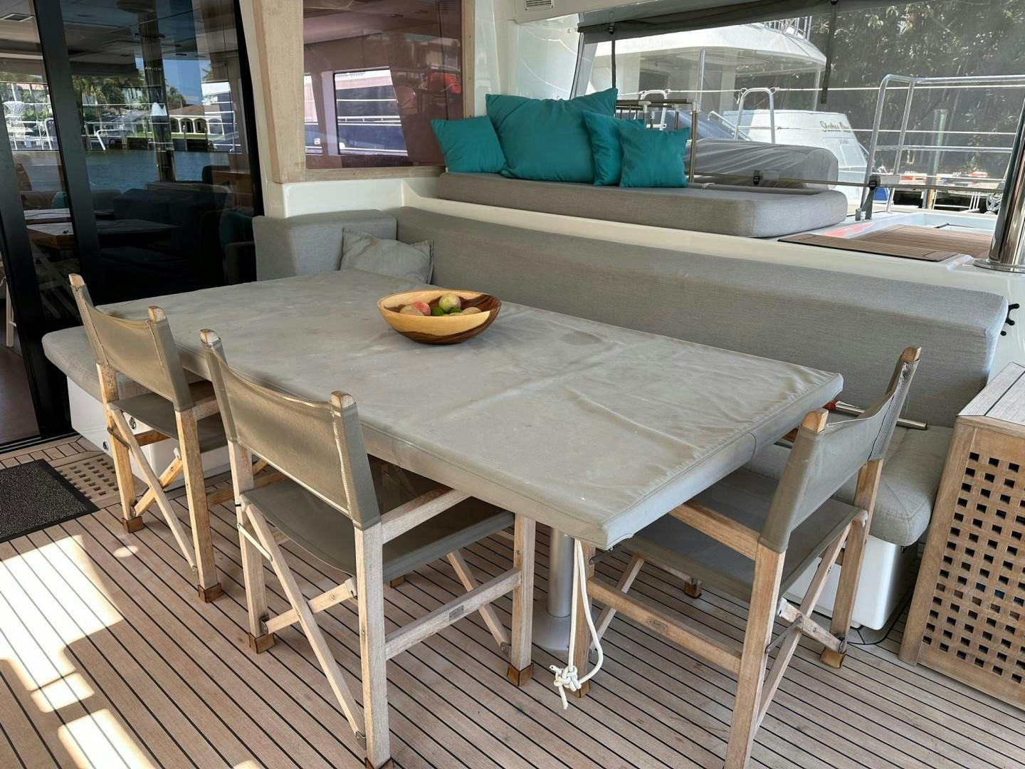 a table with chairs around it aboard OCEAN VIEW Yacht for Sale