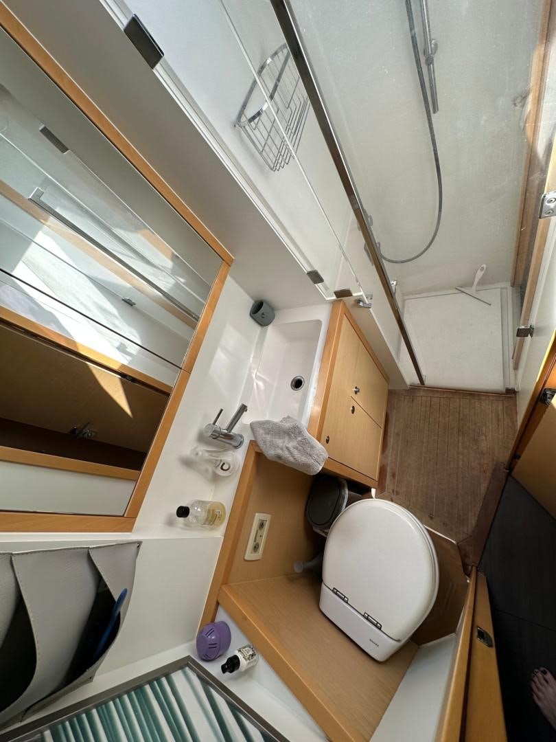 a small bathroom with a toilet aboard OCEAN VIEW Yacht for Sale