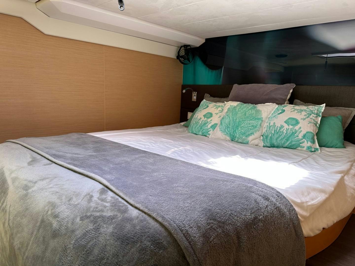 a bed with pillows aboard OCEAN VIEW Yacht for Sale