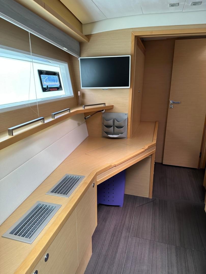 a room with a desk and a computer aboard OCEAN VIEW Yacht for Sale