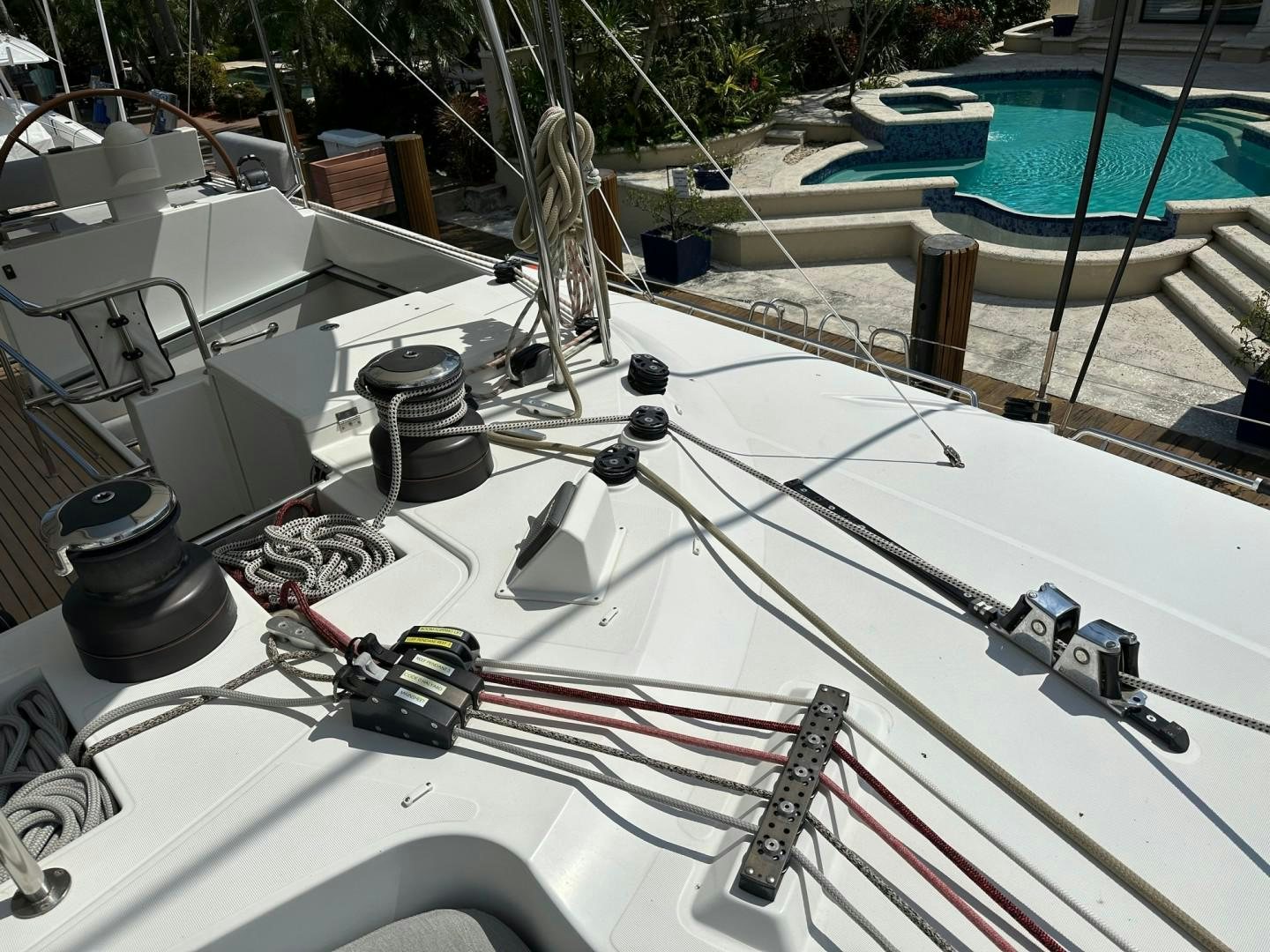 a white boat with a red line aboard OCEAN VIEW Yacht for Sale