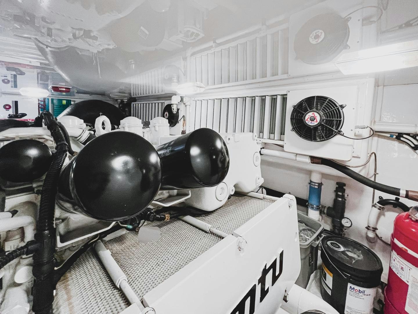 a white room with a large fan and several fans aboard MOONDANCER Yacht for Sale