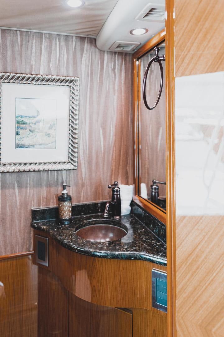 a bathroom with a sink and a mirror aboard MOONDANCER Yacht for Sale