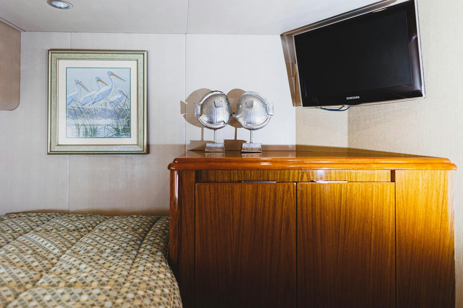 a room with a television and a bed aboard MOONDANCER Yacht for Sale