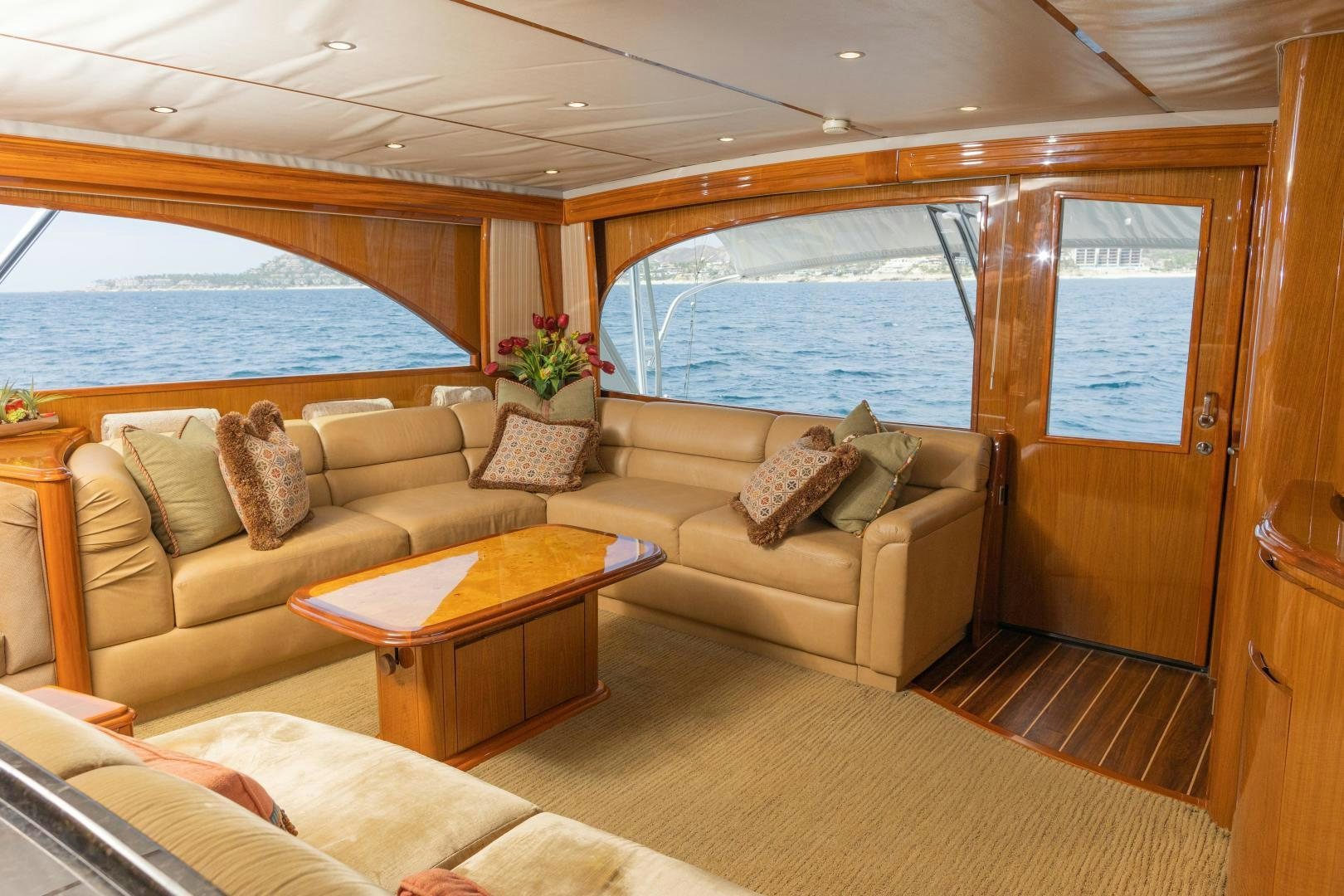 a living room with a couch and a table aboard MOONDANCER Yacht for Sale