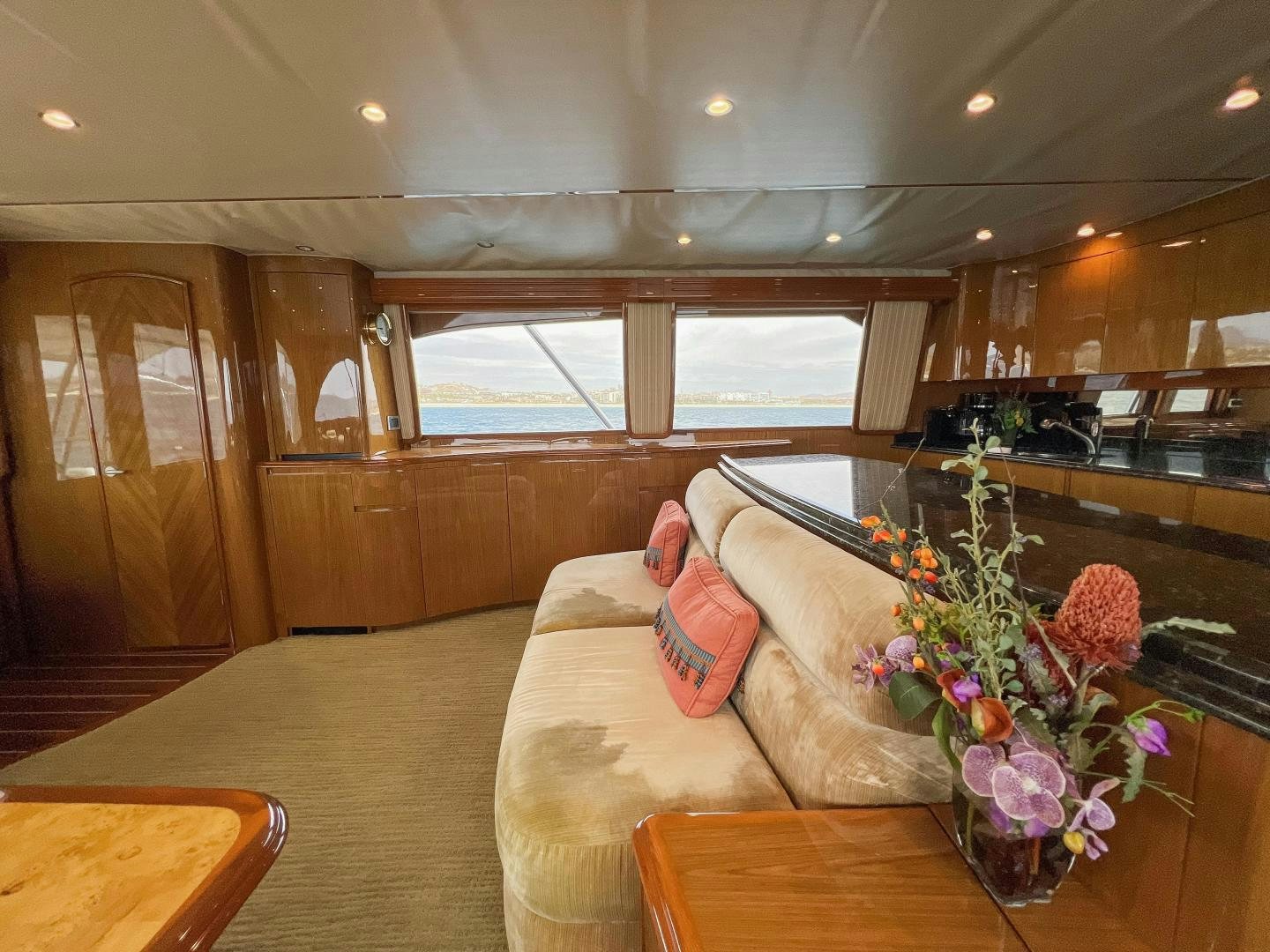 a living room with a couch and a table aboard MOONDANCER Yacht for Sale