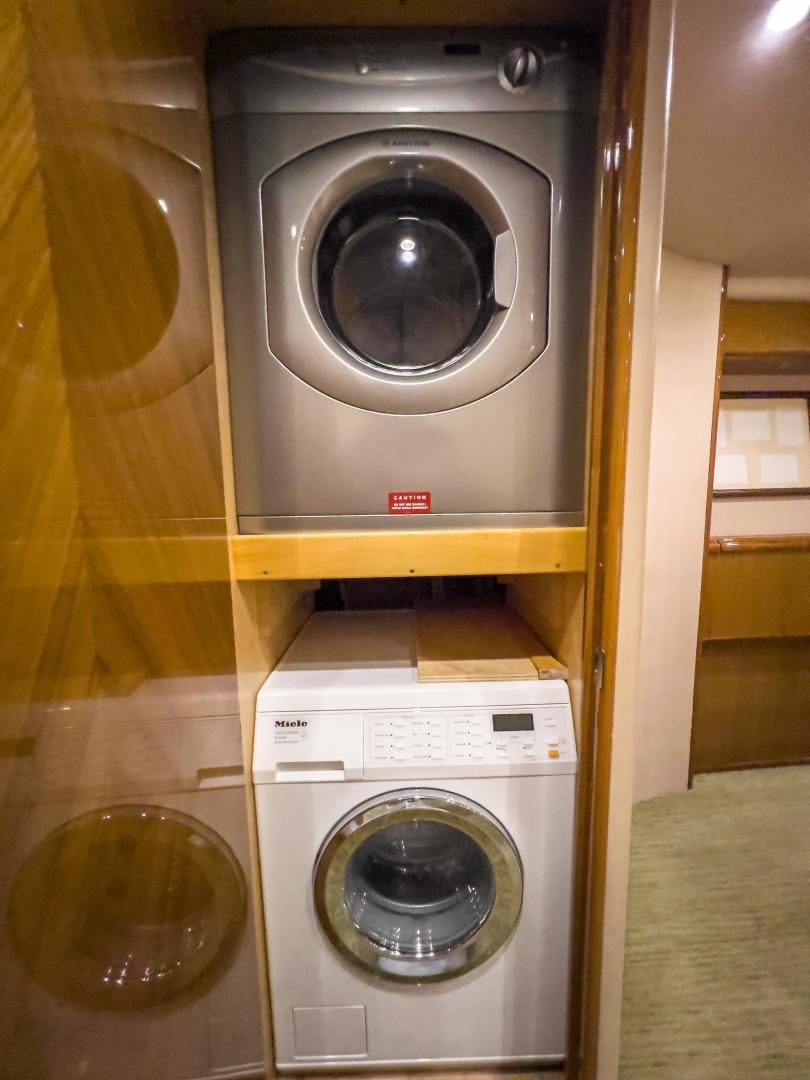 a washing machine in a room aboard MOONDANCER Yacht for Sale