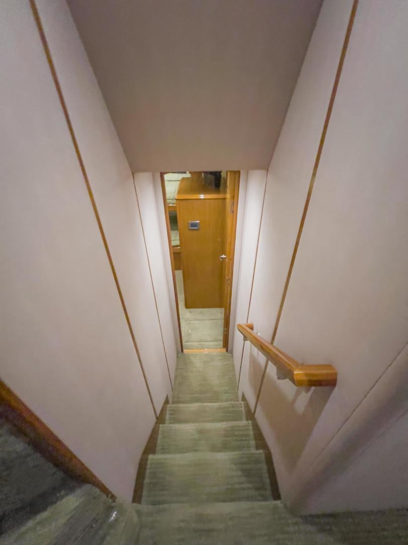 a hallway with a door and a carpet aboard MOONDANCER Yacht for Sale