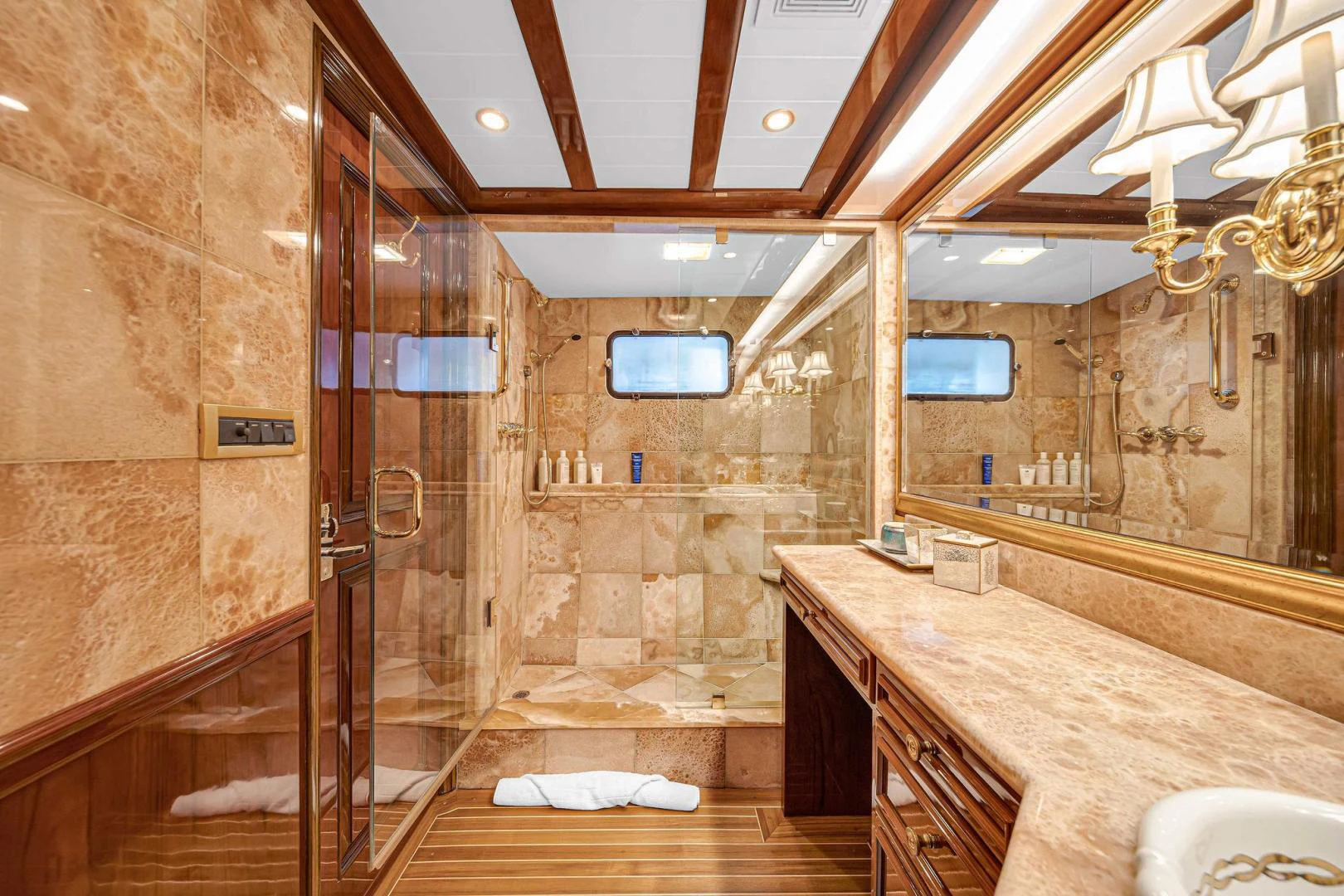 a bathroom with marble counter tops aboard INEVITABLE Yacht for Sale