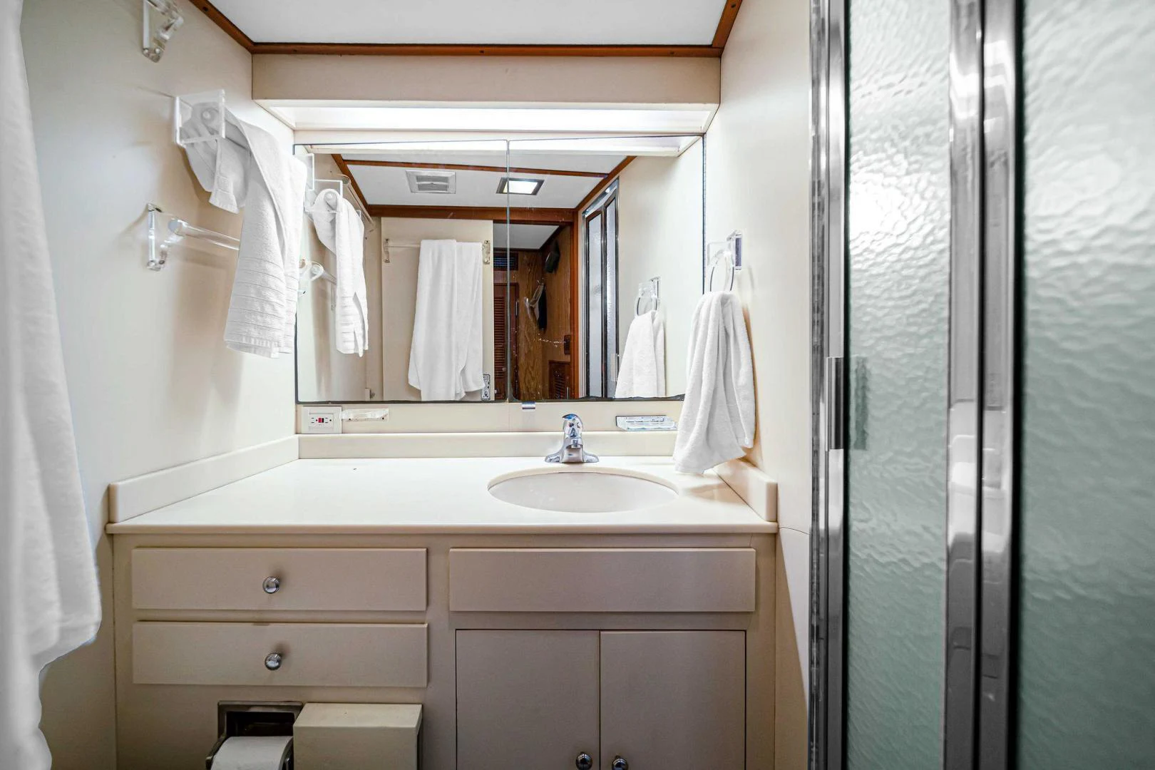 a bathroom with a sink and a mirror aboard INEVITABLE Yacht for Sale