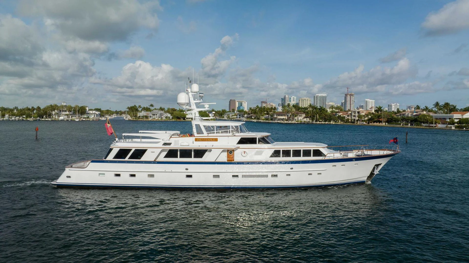 a white boat on the water aboard INEVITABLE Yacht for Sale