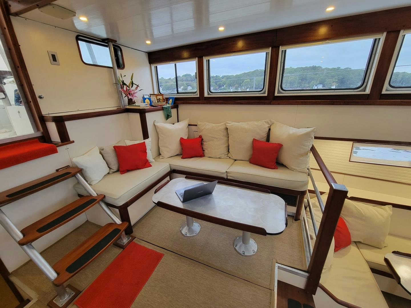 a living room with a couch and a coffee table aboard TARA Yacht for Sale