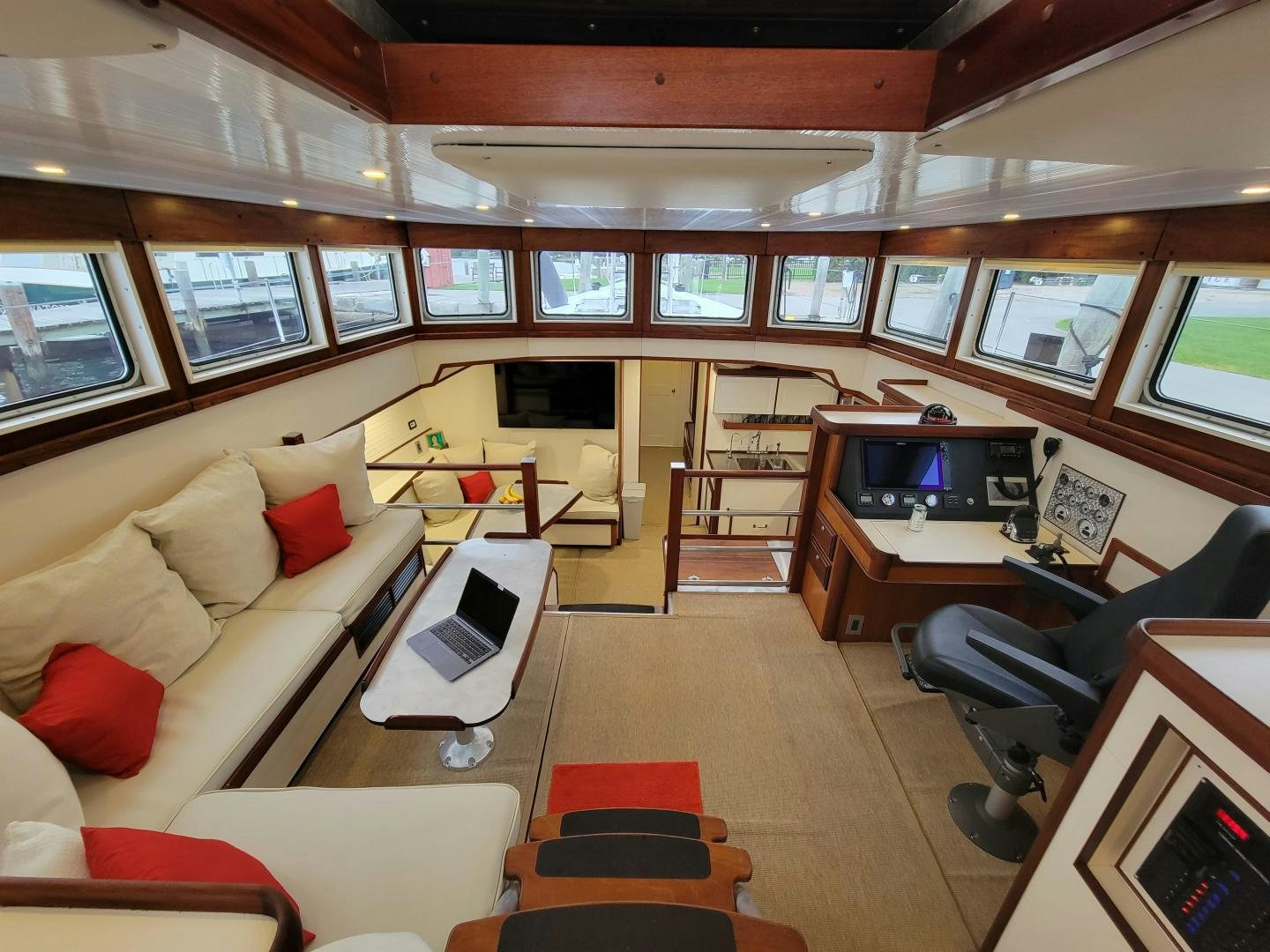 a room with a couch and a tv aboard TARA Yacht for Sale