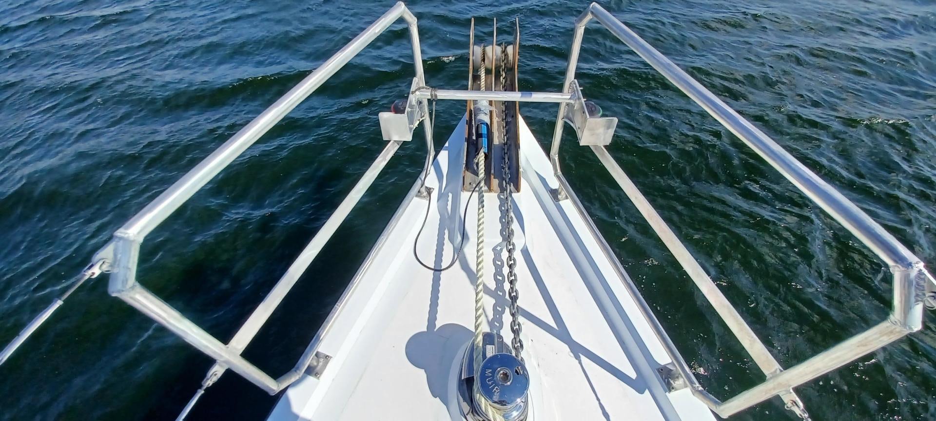 a large ship in the water aboard TARA Yacht for Sale