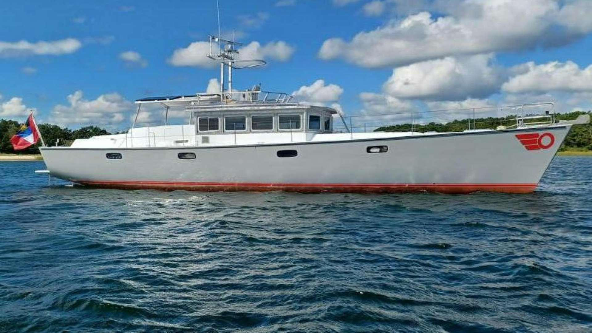 a boat in the water aboard Tara Yacht for Sale