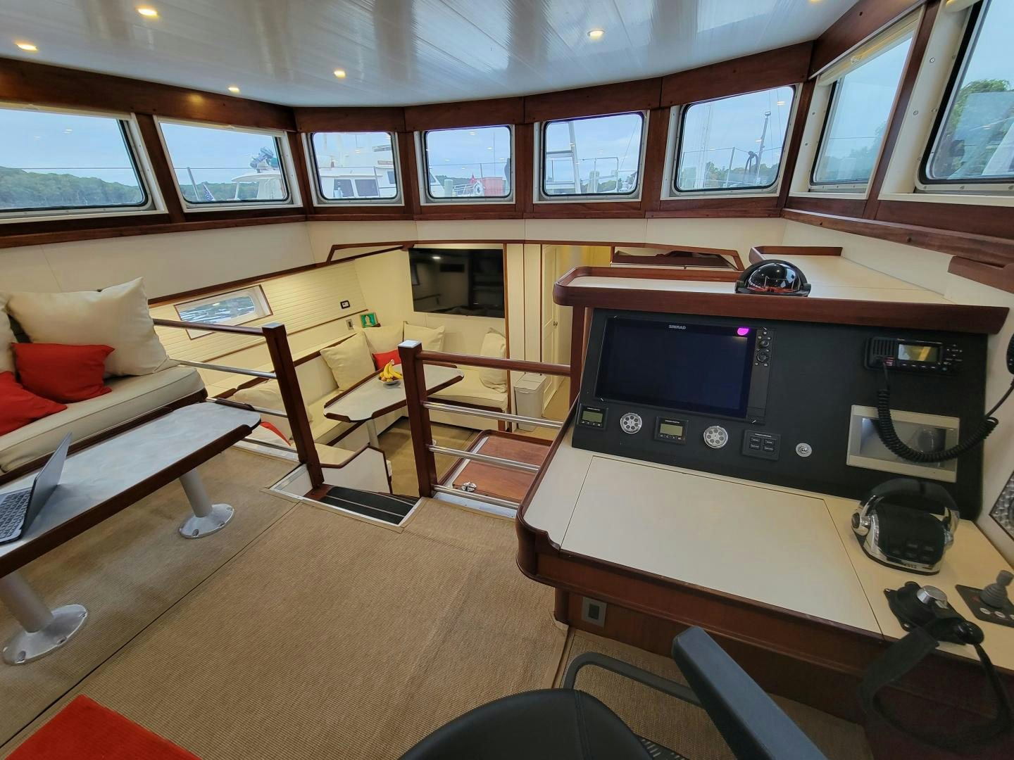 a room with a tv and a couch aboard TARA Yacht for Sale