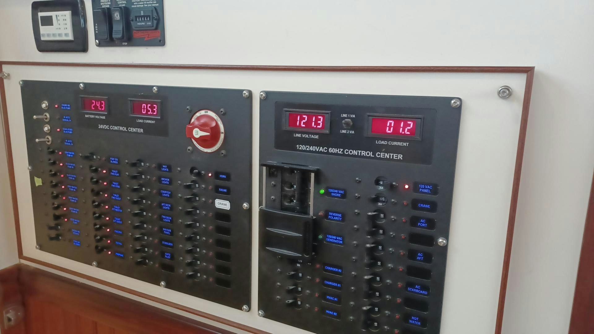 a white rectangular electronic device with a screen and buttons aboard TARA Yacht for Sale