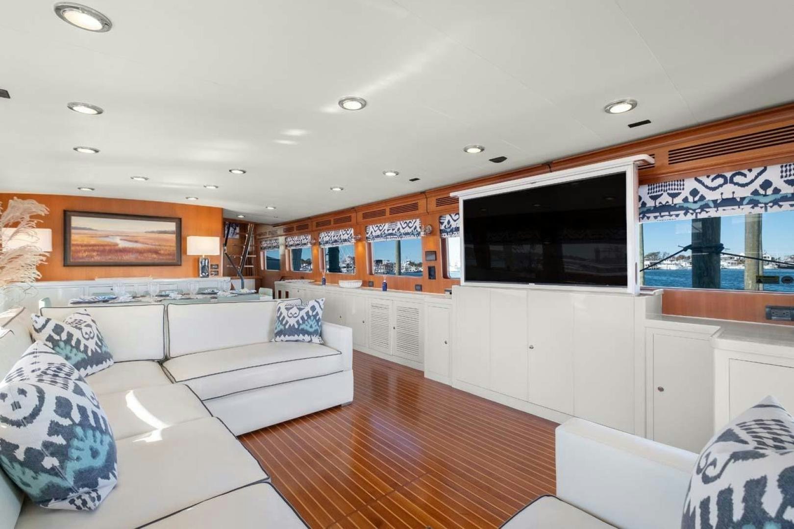 a living room with a large television aboard PIVOT Yacht for Sale