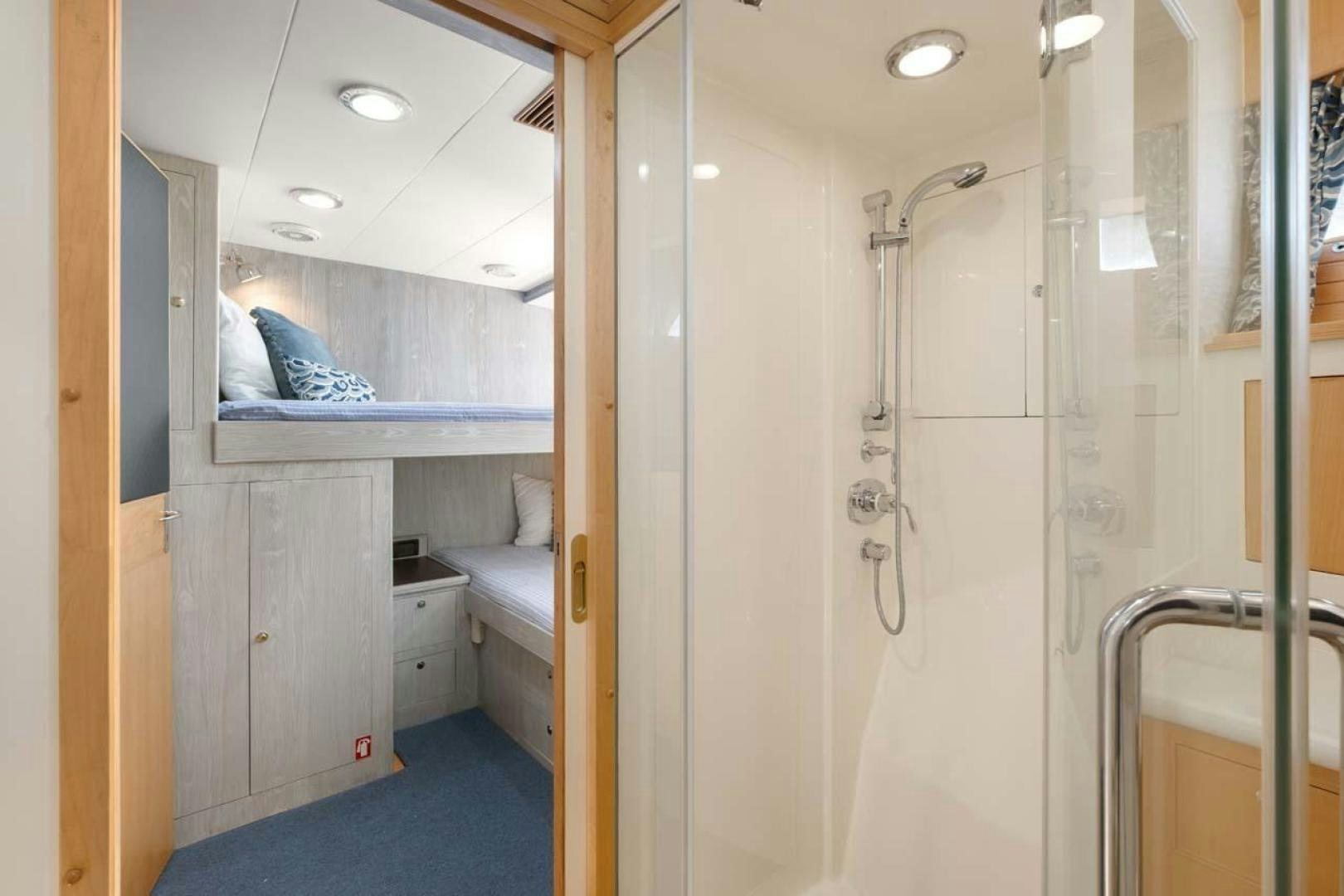 a person sitting in a room aboard PIVOT Yacht for Sale