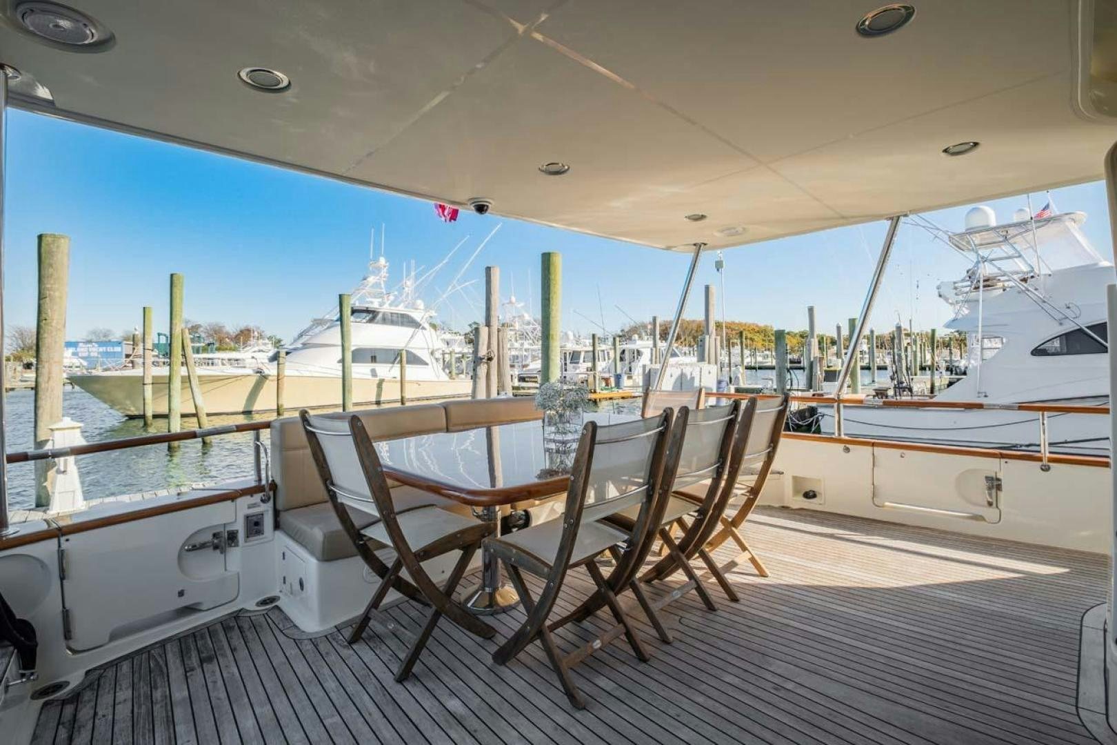 a deck with chairs on it aboard PIVOT Yacht for Sale