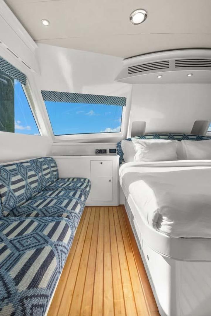 a room with two beds aboard PIVOT Yacht for Sale