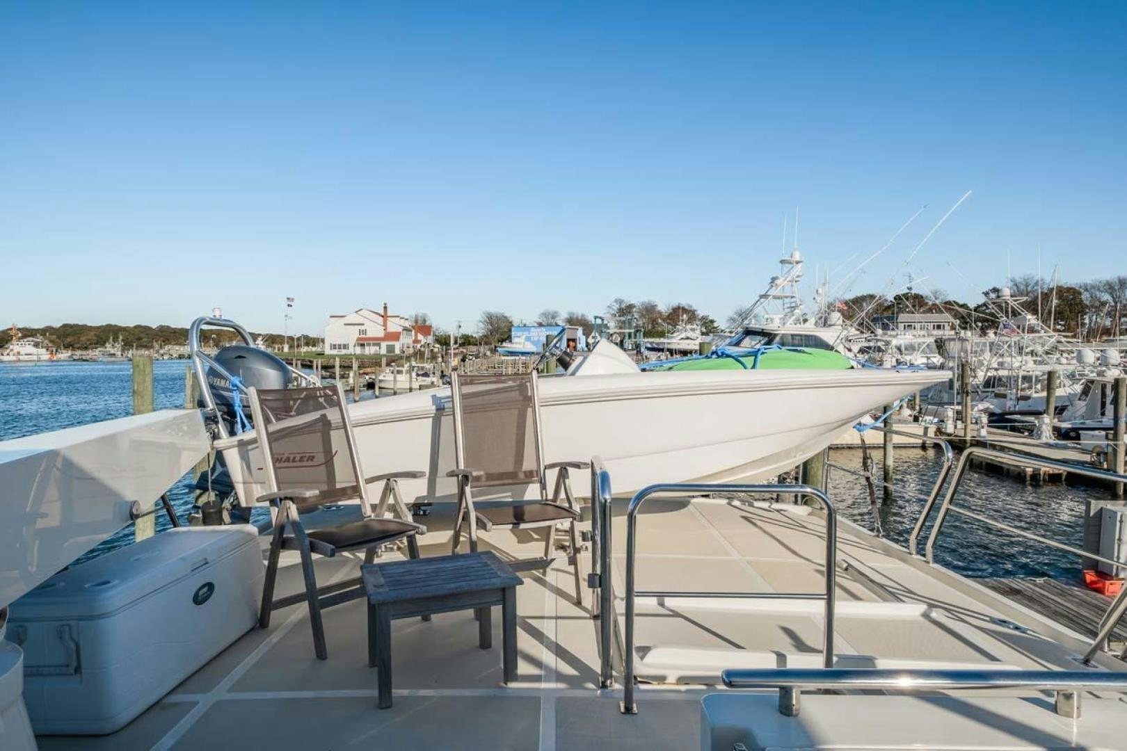 a group of chairs on a dock aboard PIVOT Yacht for Sale