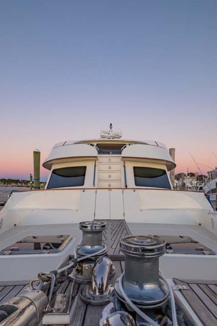 a boat docked at a pier aboard PIVOT Yacht for Sale