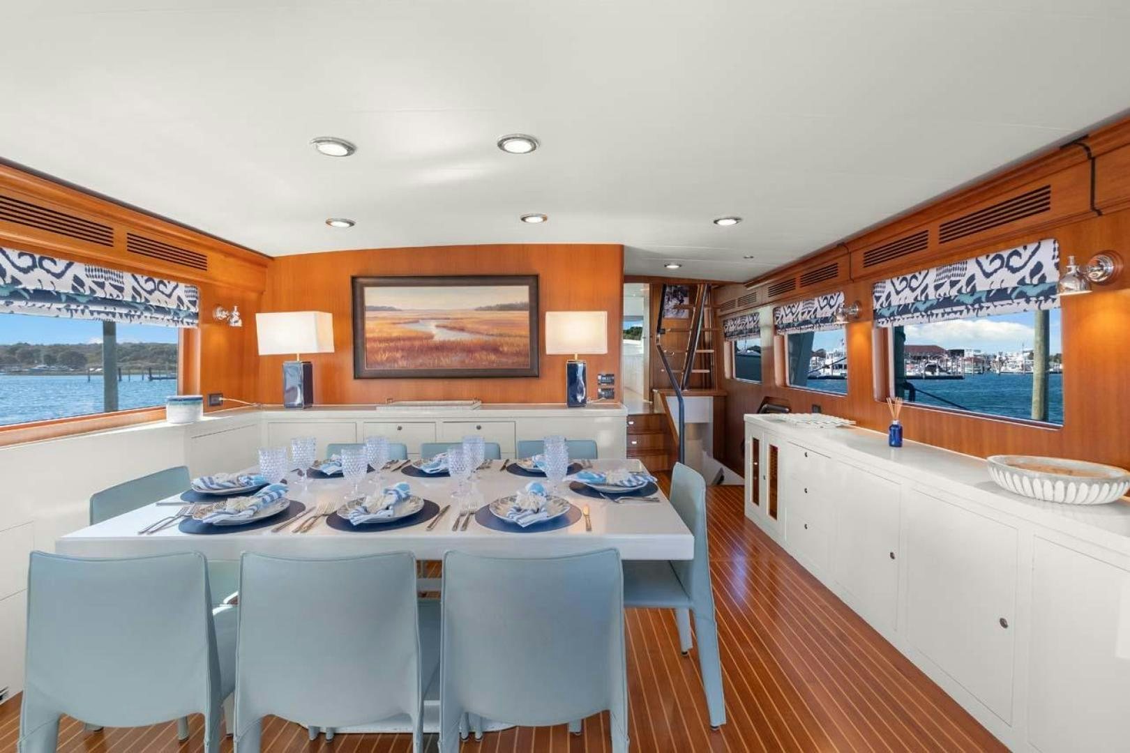 a dining room with a table and chairs aboard PIVOT Yacht for Sale
