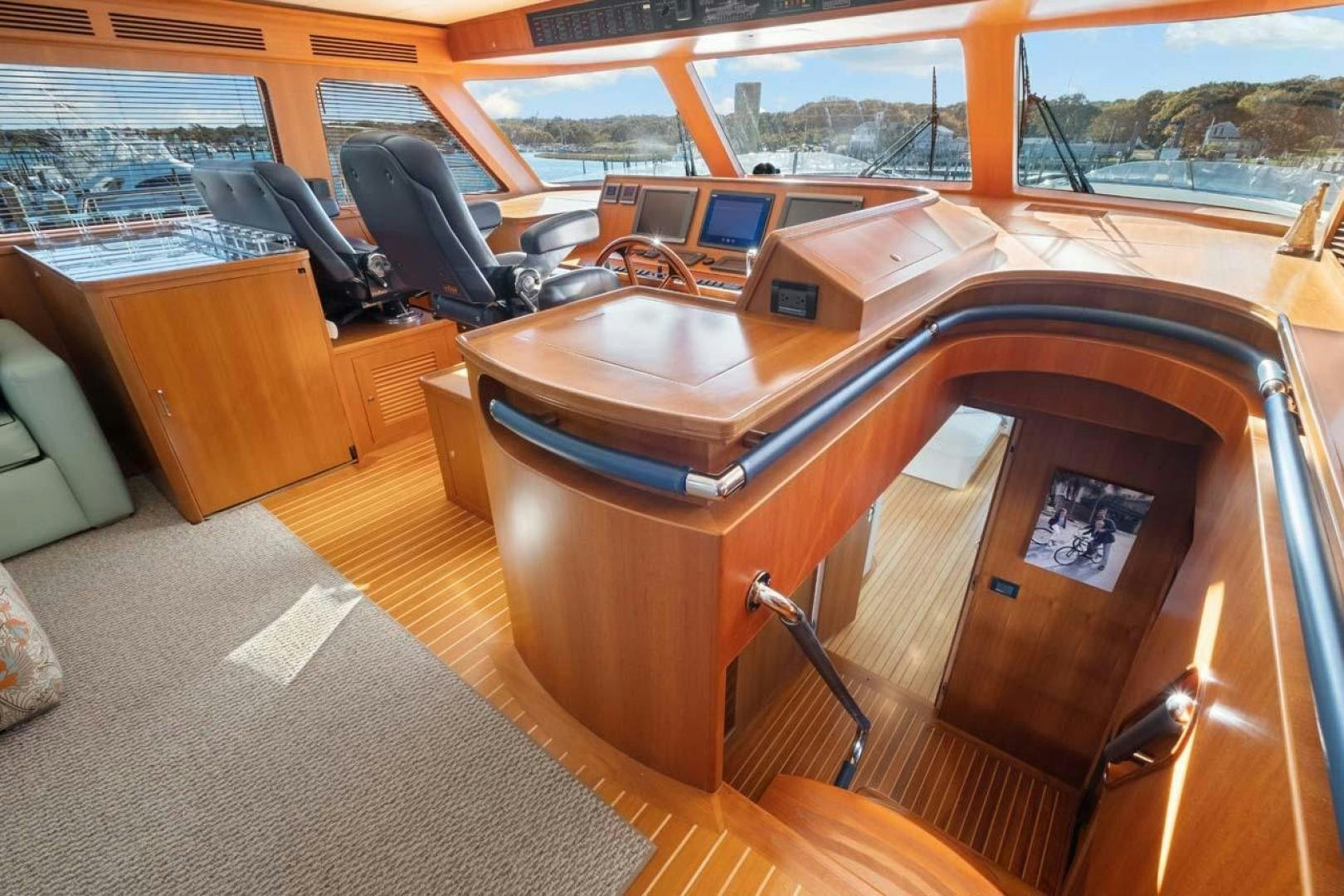 a room with a desk and a chair aboard PIVOT Yacht for Sale