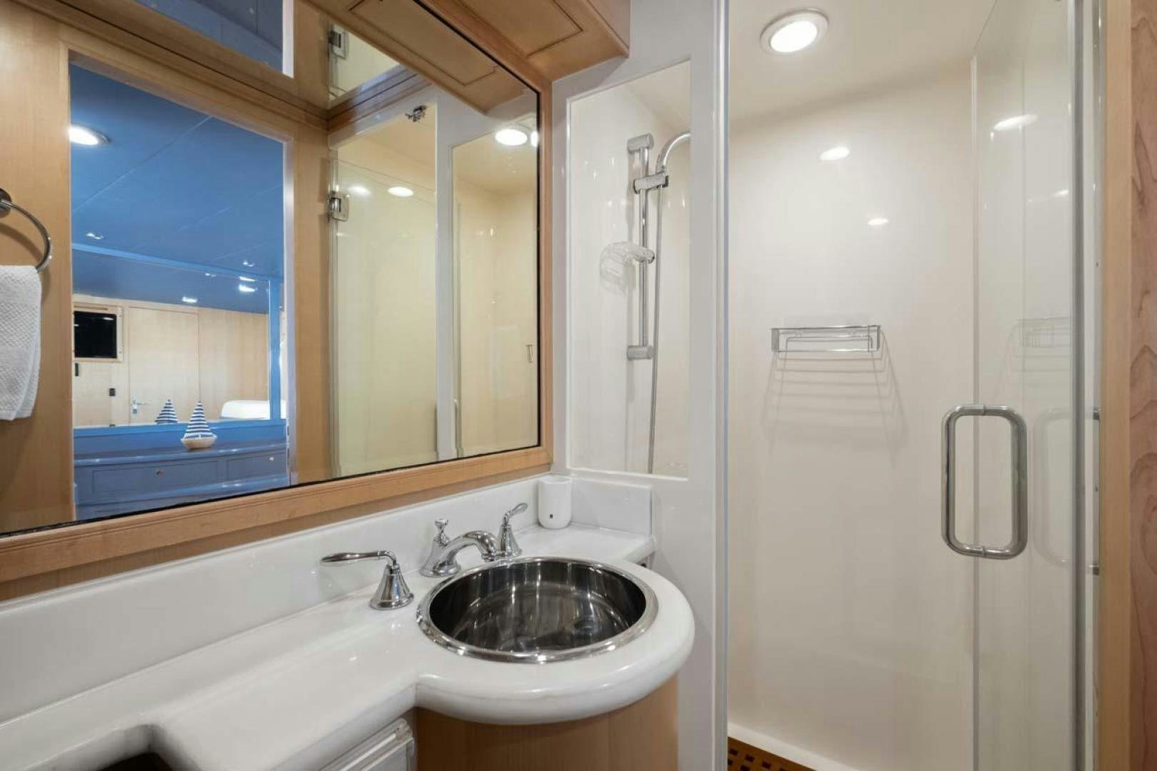 a bathroom with a large mirror aboard PIVOT Yacht for Sale