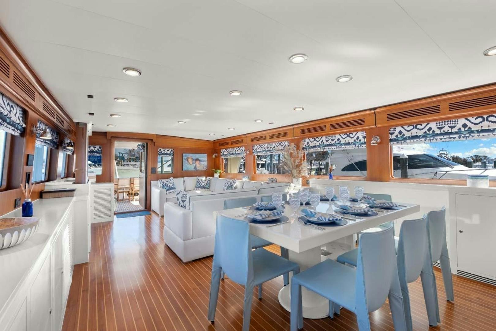 a large kitchen with a dining table aboard PIVOT Yacht for Sale