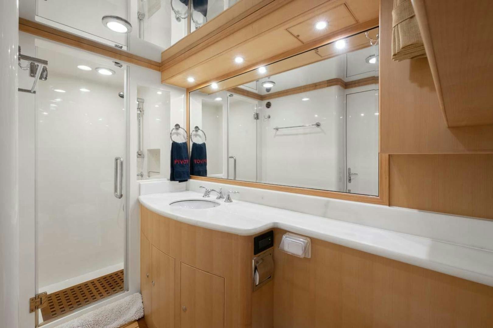 a bathroom with a large mirror aboard PIVOT Yacht for Sale