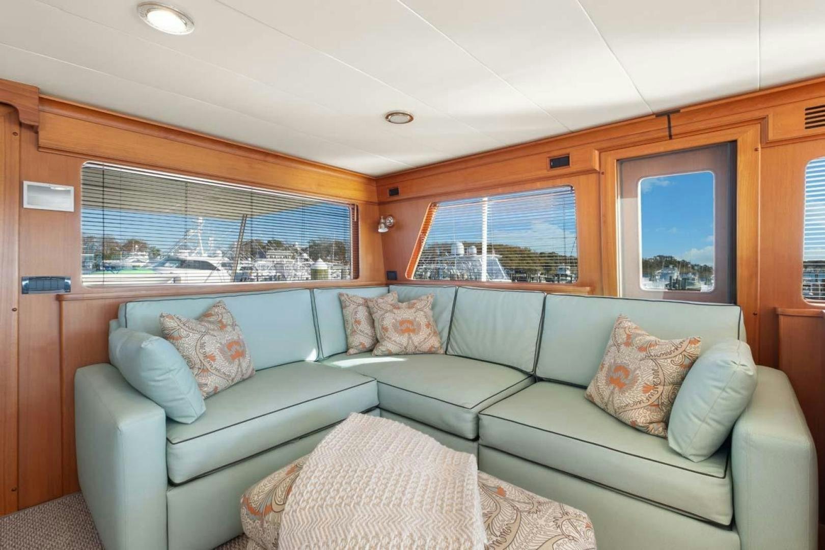 a couch in a cabin aboard PIVOT Yacht for Sale