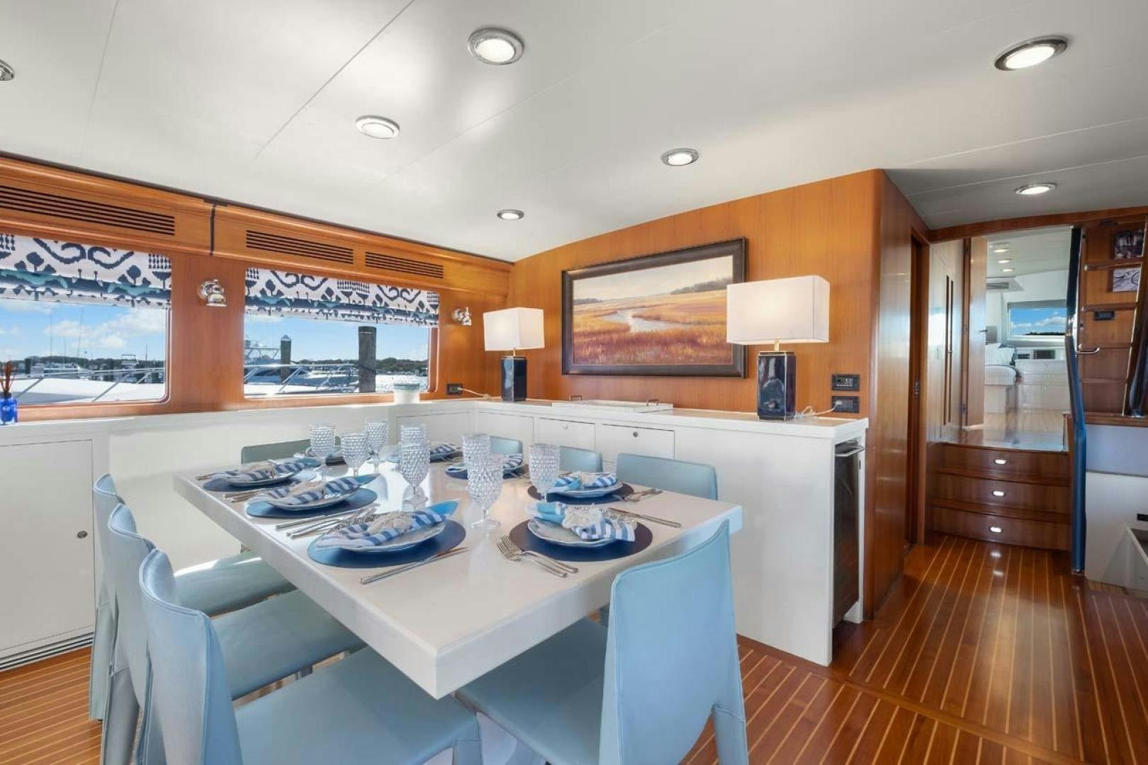 a dining room with a table aboard PIVOT Yacht for Sale