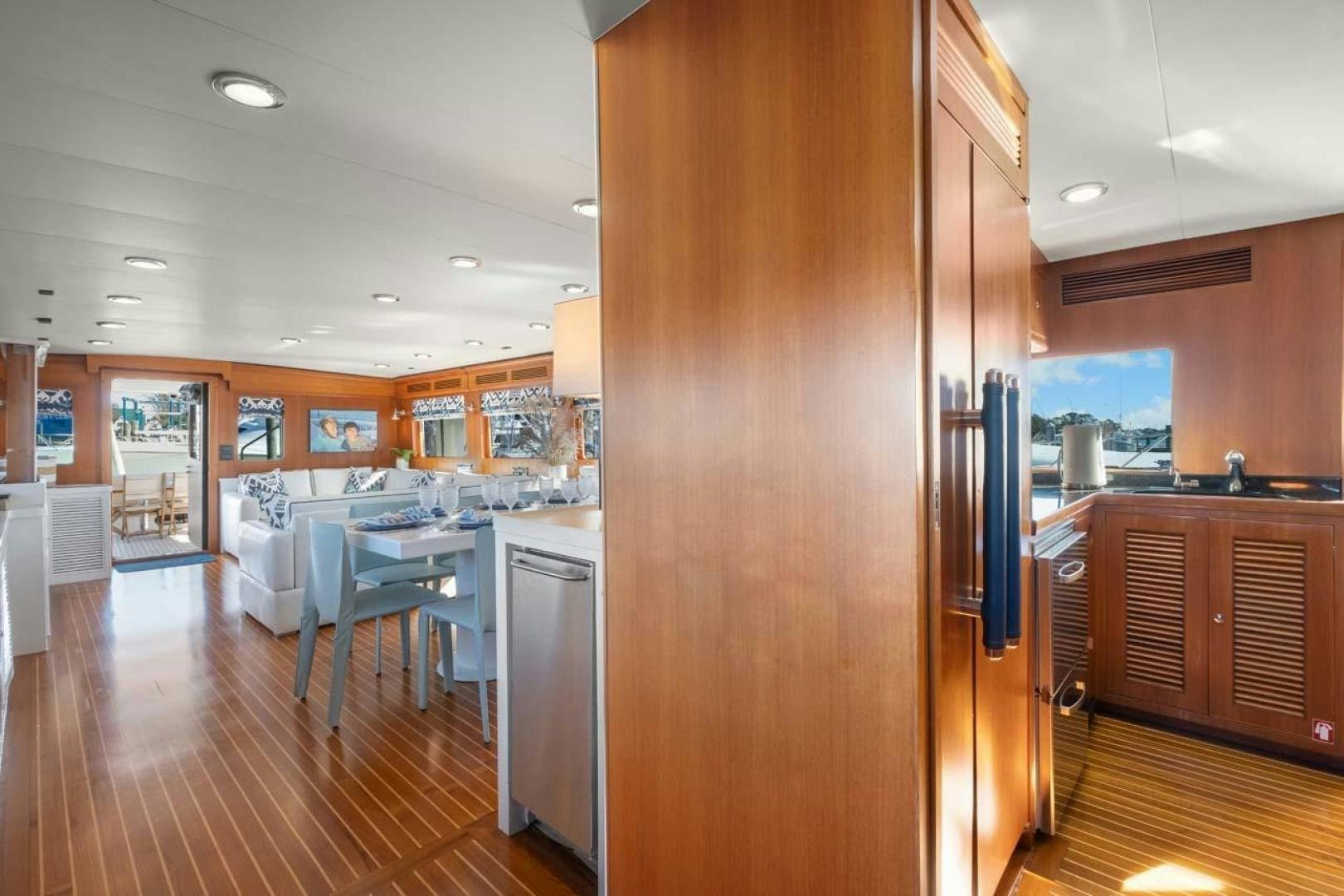 a kitchen with a large refrigerator aboard PIVOT Yacht for Sale