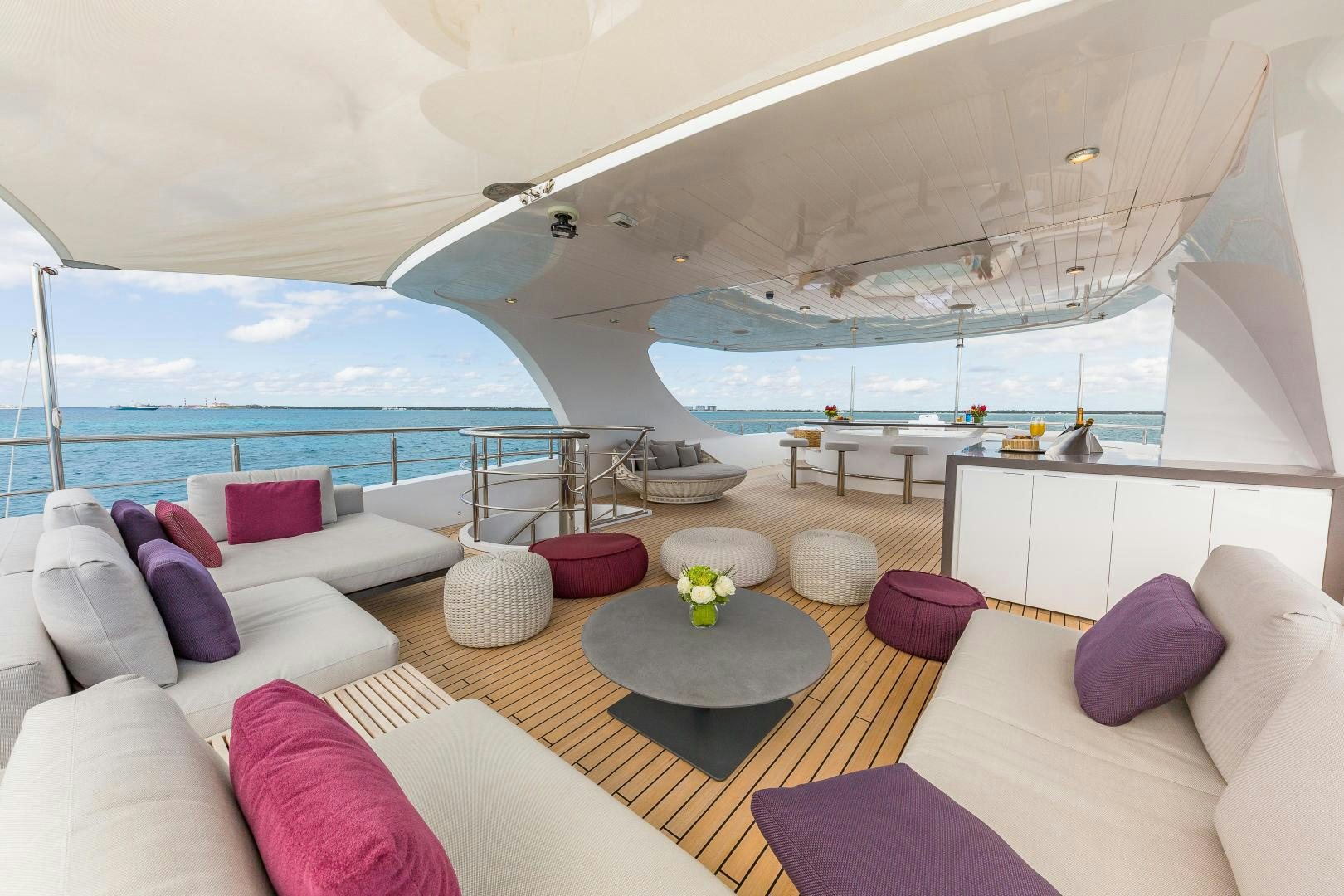 a room with a large window and a view of the ocean aboard BIG SKY Yacht for Sale
