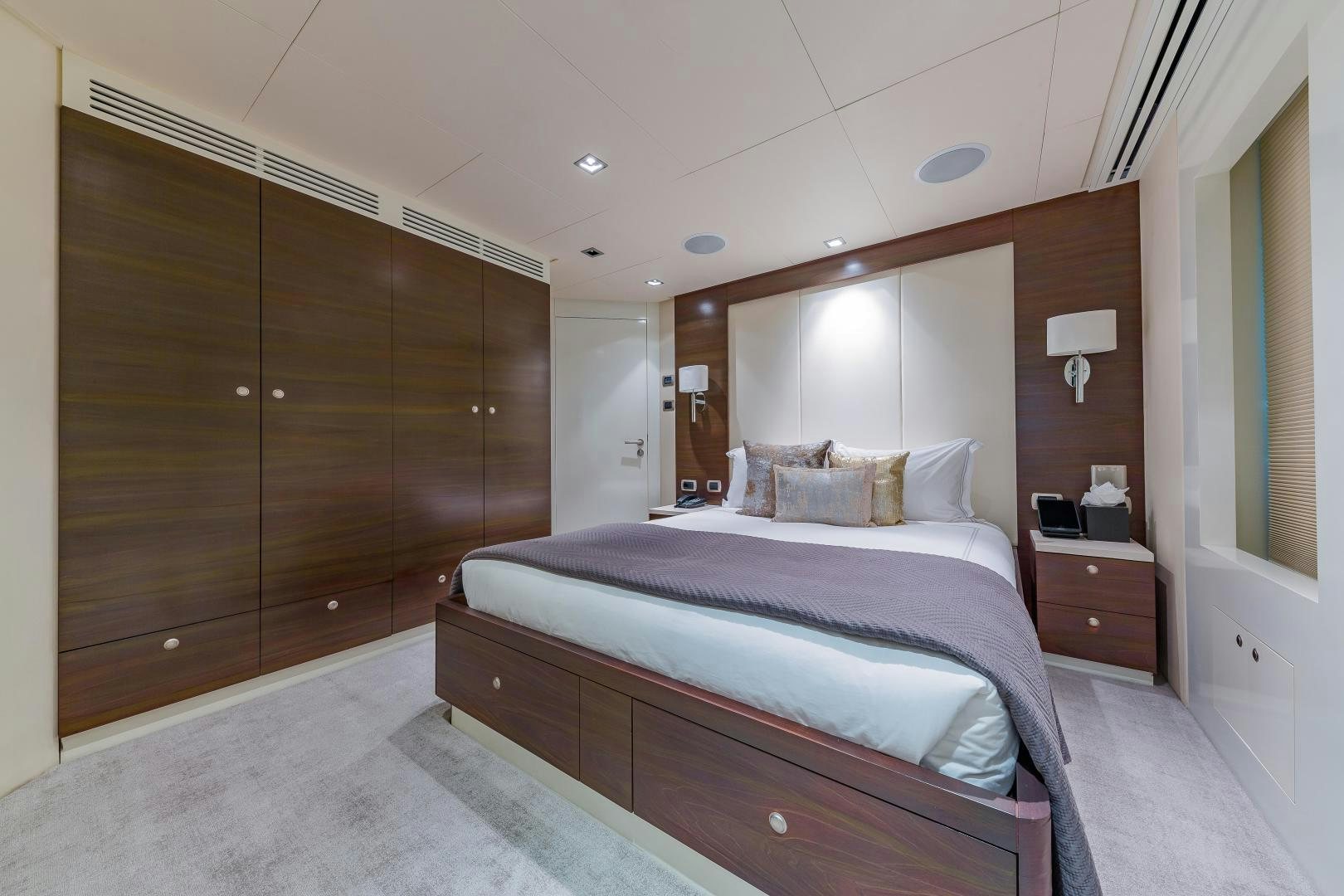 a bed in a room aboard BIG SKY Yacht for Sale