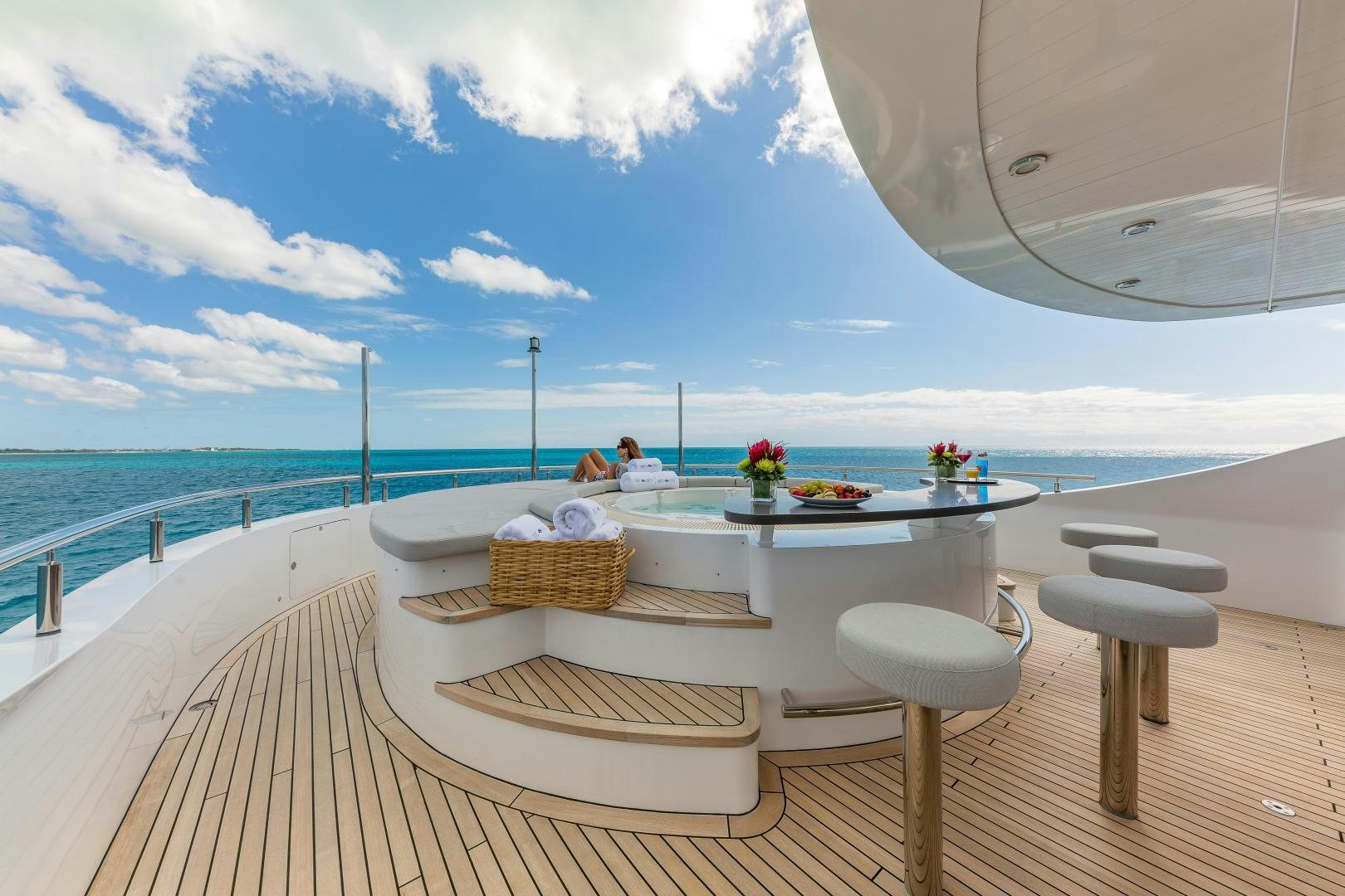 a table on a deck overlooking the ocean aboard BIG SKY Yacht for Sale