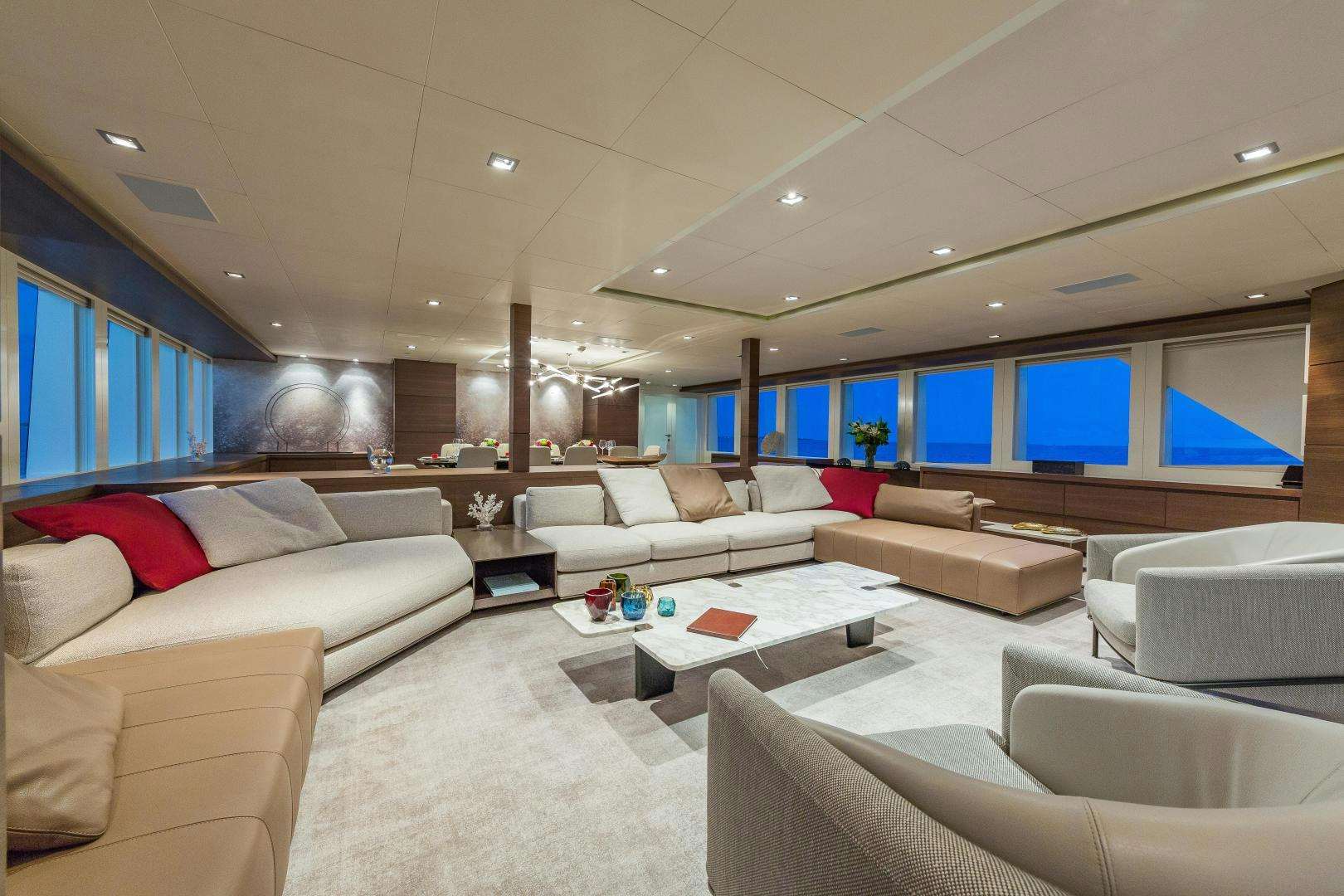 a room with couches and a television aboard BIG SKY Yacht for Sale