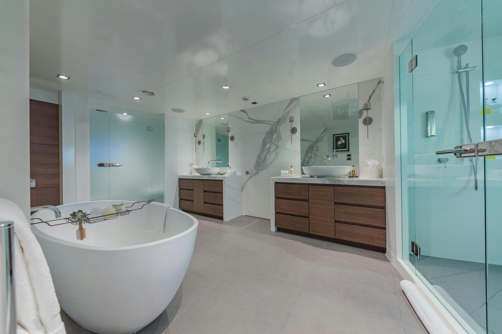 a bathroom with a bathtub and sink aboard BIG SKY Yacht for Sale