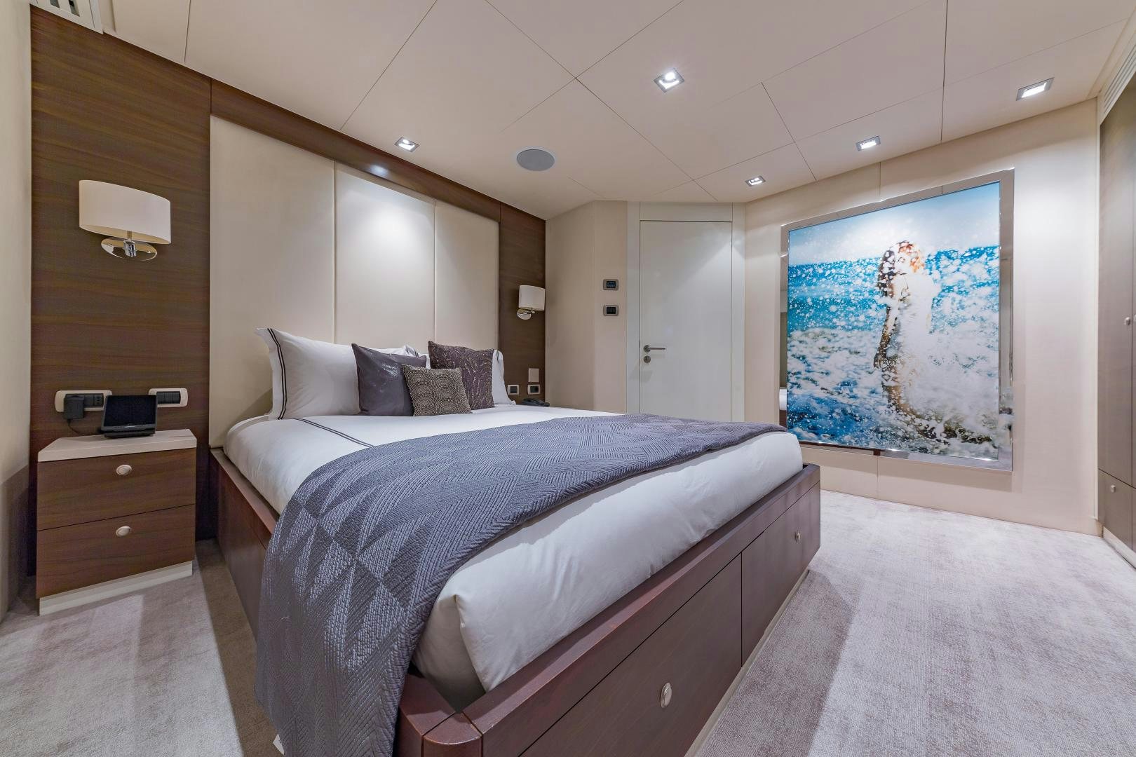 a bedroom with a large bed aboard BIG SKY Yacht for Sale