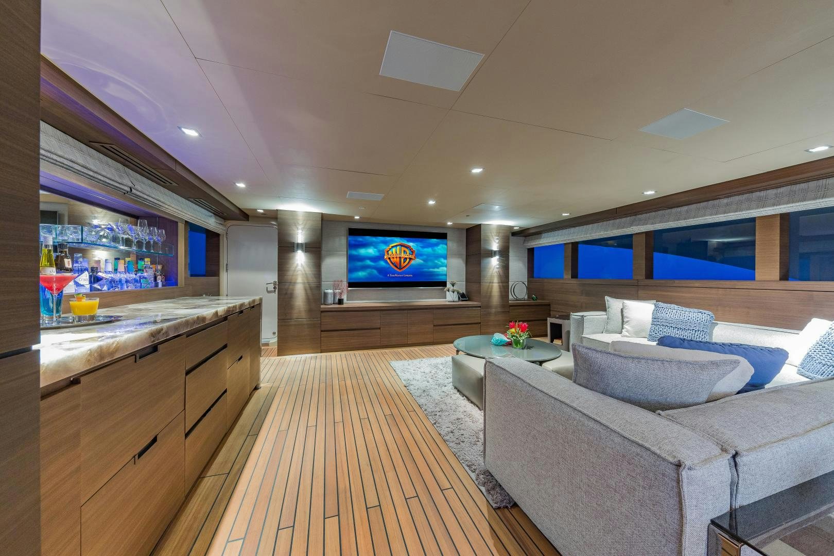 a living room with a wood floor aboard BIG SKY Yacht for Sale