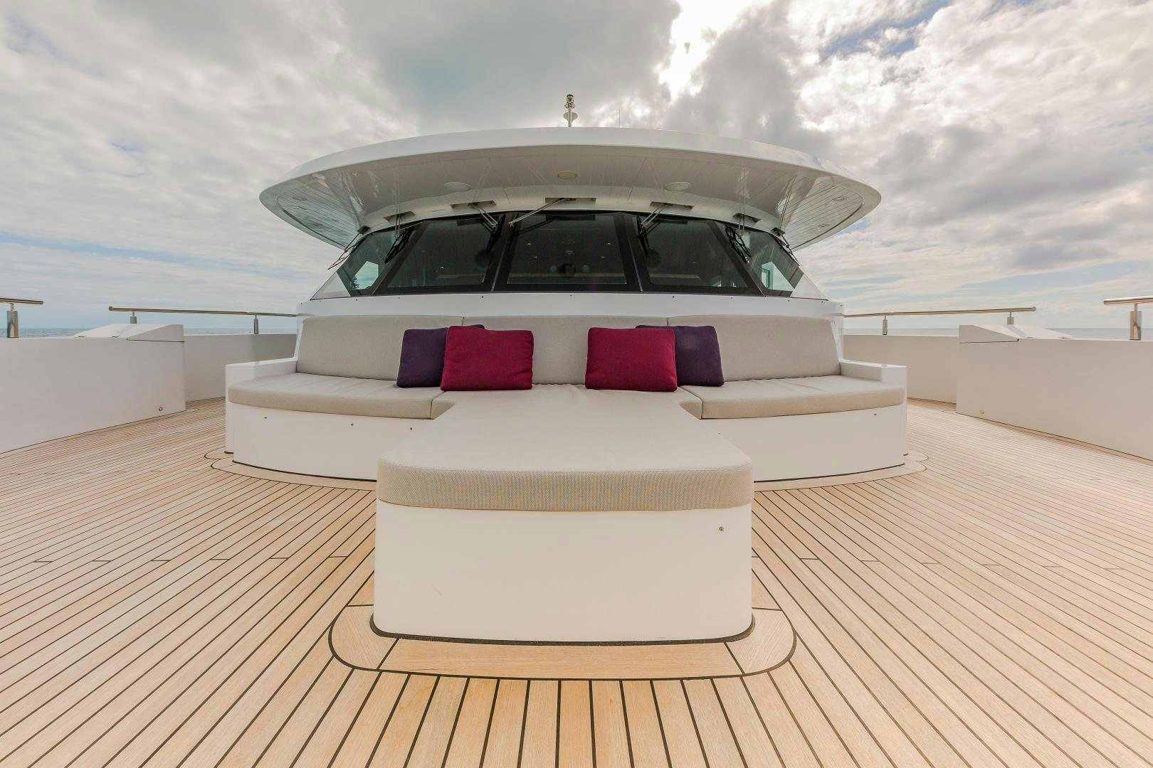 a white car on a wooden deck aboard BIG SKY Yacht for Sale