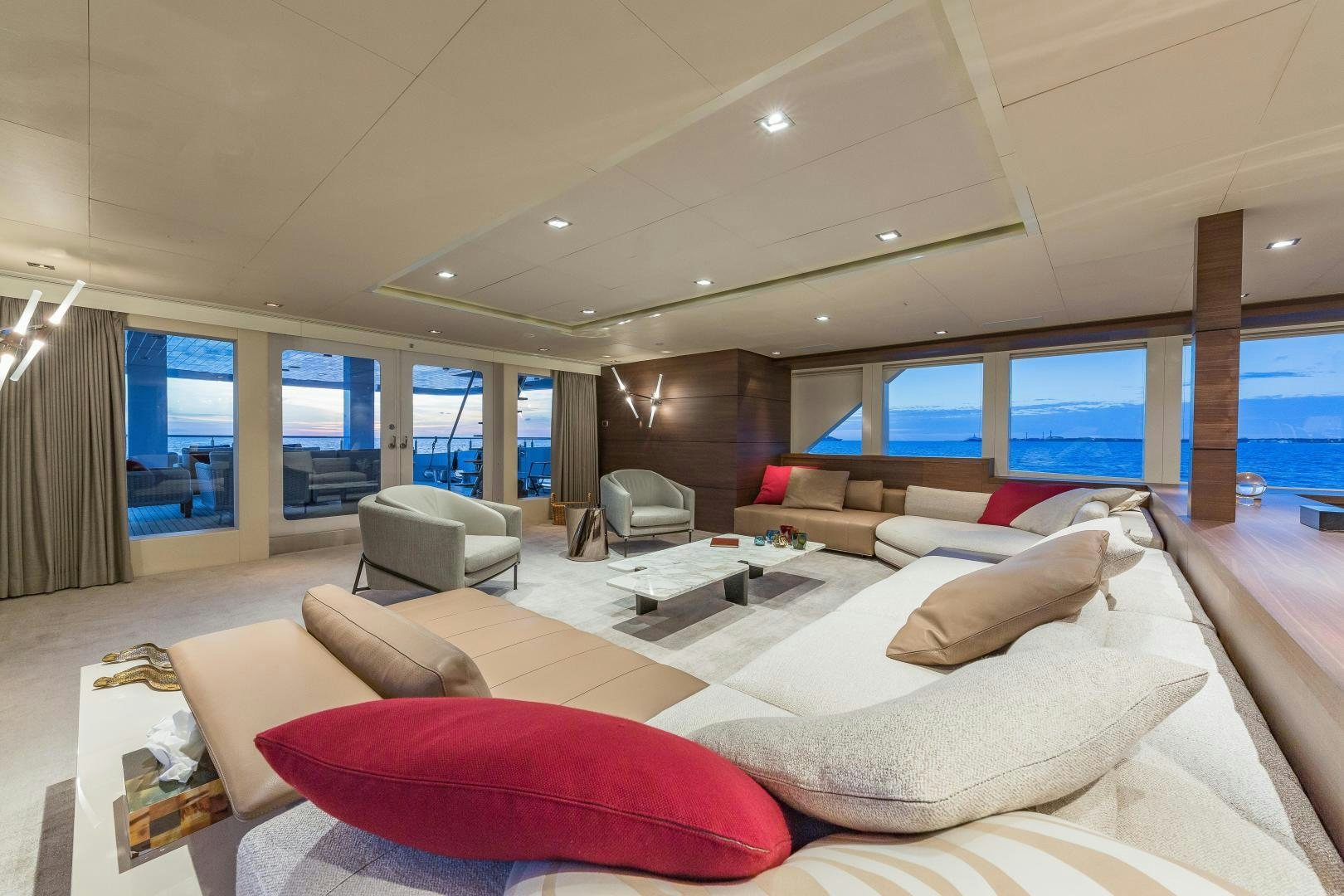 a room with a couch and a tv aboard BIG SKY Yacht for Sale