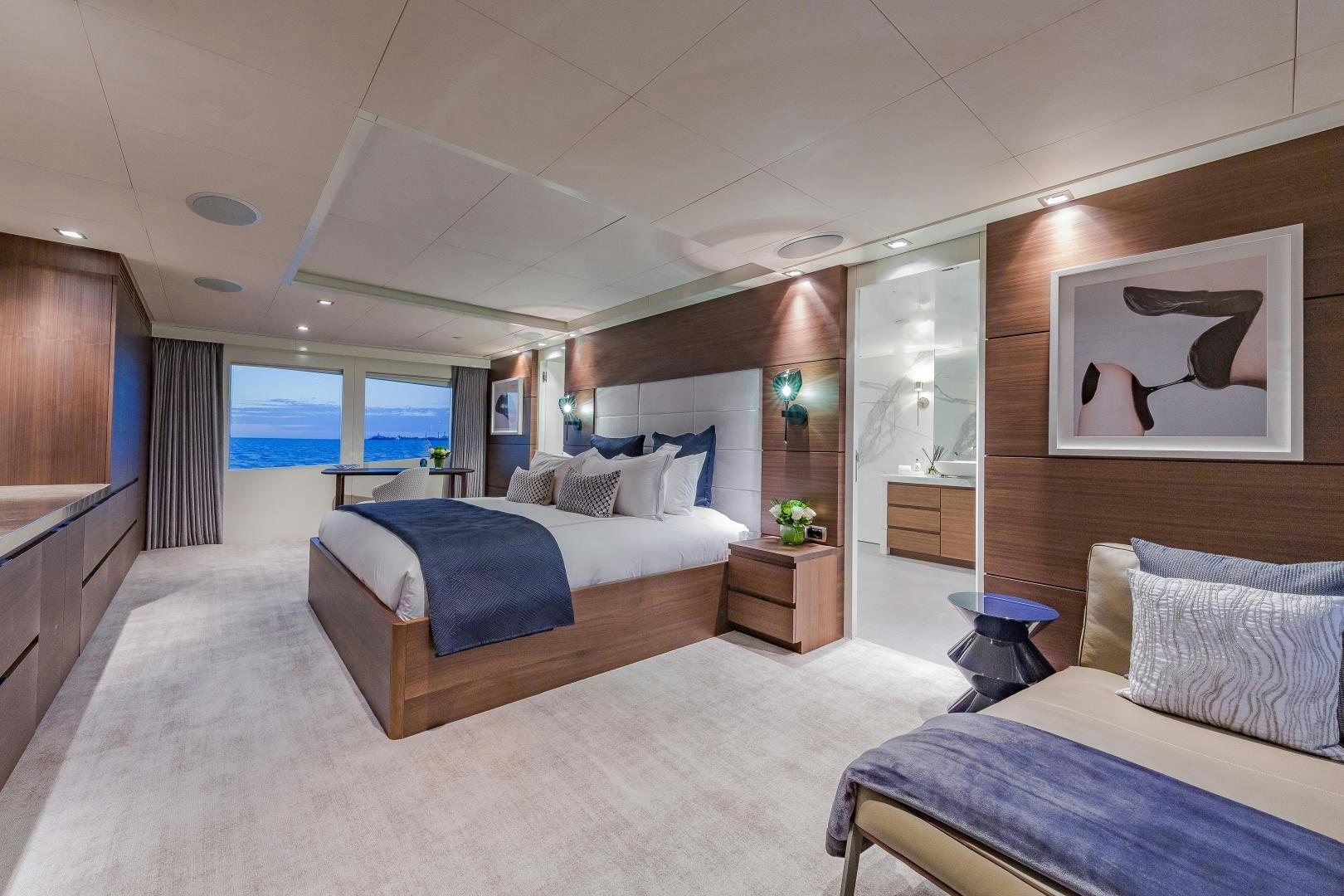 a room with a bed and a window aboard BIG SKY Yacht for Sale