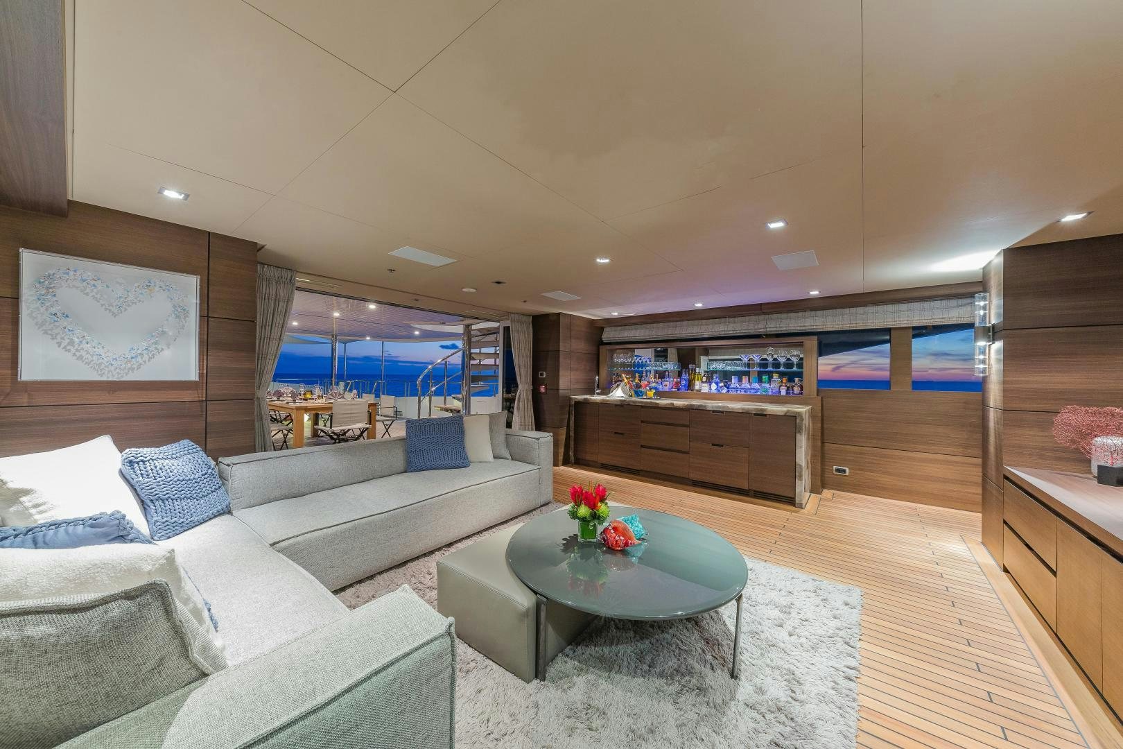 a living room with a large window aboard BIG SKY Yacht for Sale