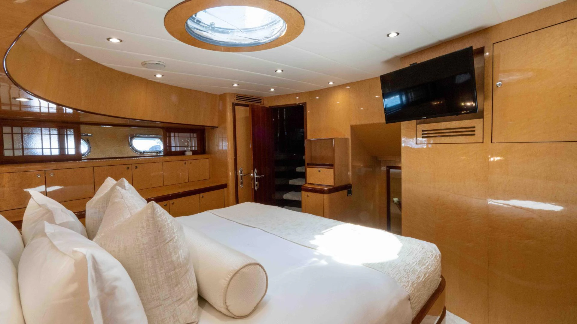 a room with a bed and a desk aboard NEVER SETTLE Yacht for Sale