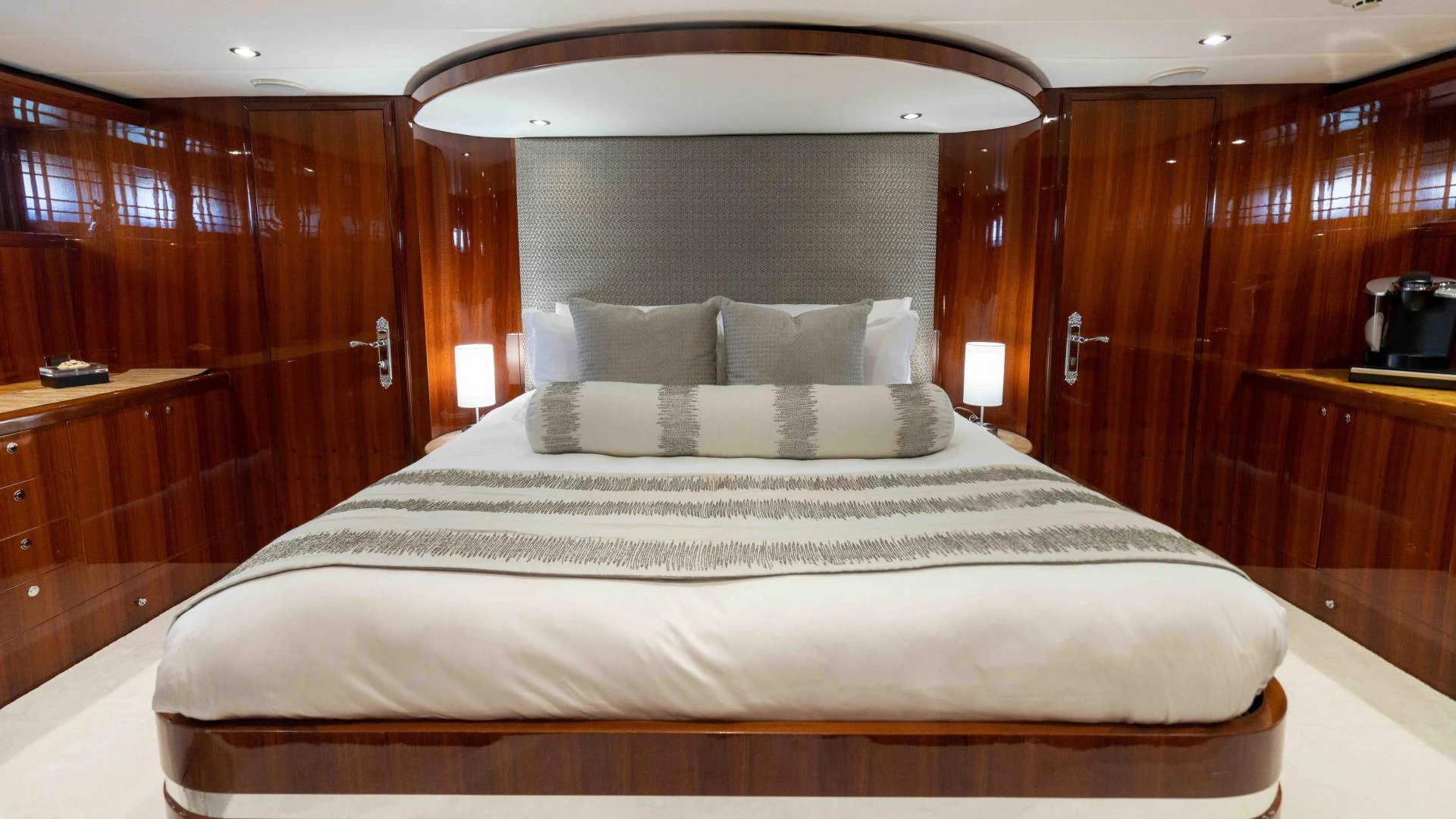 a bed with a mirror above it aboard NEVER SETTLE Yacht for Sale