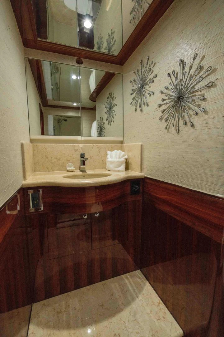 a bathroom with a large mirror aboard NEVER SETTLE Yacht for Sale